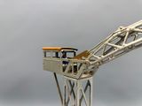 a toy crane that is sitting on top of a table