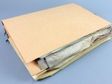 a brown book with a bunch of papers inside of it