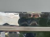 a reflection of a man in the mirror of a car