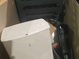 a box with a toilet and other items in it