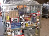 a metal cart with many items in it in a warehouse
