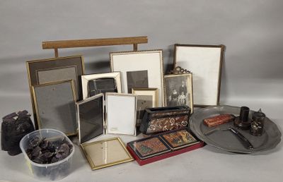 a lot of picture frames and pictures on a table