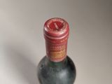 a bottle of wine that is sitting on a table