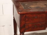 a small wooden desk with a drawer on top of it