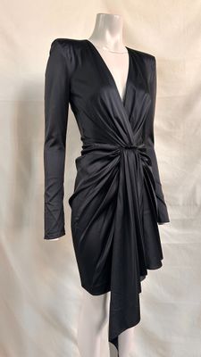 the dress is black and has long sleeves on it