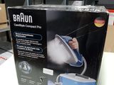 packaging of a braun steam cleaner in a box on a table