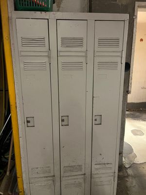 two lockers that are in a room with a yellow wall