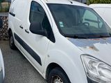 a white van that is parked in a parking lot
