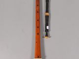 an old recorder with a wooden handle and a wooden stick