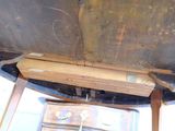 a piece of wood that has been removed from the underside of a boat