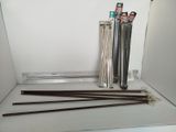 a lot of sticks that are sitting on a shelf