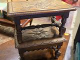 a small wooden table with a bench on top of it