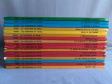 six children ' s books stacked on top of each other on a table