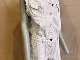 an image of a mannequin wearing a white shirt and shorts