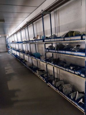 a long shelf with many items on it in a room