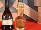 three bottles of wine sitting on a table next to each other