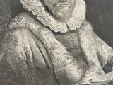 an old black and white photo of a man with a book