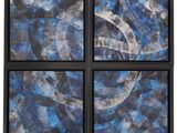 a set of four blue and white abstract paintings