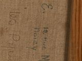 a close up of a piece of wood with writing on it