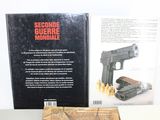 a book on the table with a gun on it