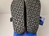 the soles of a pair of shoes are shown on a box