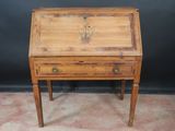 an old wooden desk with a drawer on top of it