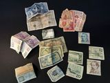 a lot of money sitting on a black table