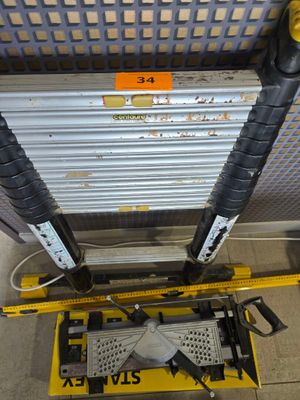 a fork lift with a yellow sign on the side of it