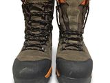 a pair of boots that are on a white surface