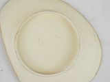 a white plate with writing on it sitting on a table
