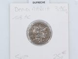 a close up of a piece of silver coin on a white card