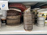 a shelf with a lot of dishes and bowls on it