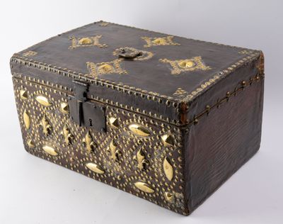 a small wooden box with gold decorations on it