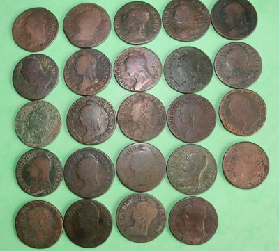 an image of a pile of old coins on a green surface