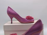 purple high heeled shoes with flower decoration on the toe