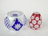 two vases sitting next to each other on a table