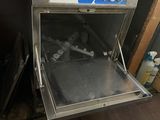 a small oven that is open in the kitchen