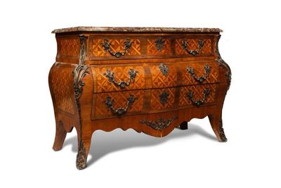 a wooden chest of drawers with a marble top