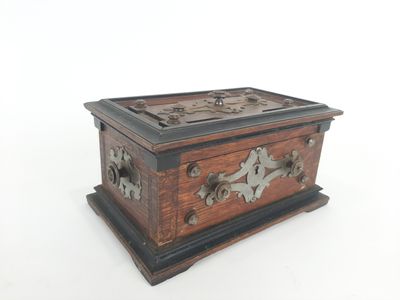 an old wooden box sitting on top of a white surface