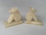 pair of white jade figurines of a man and a woman