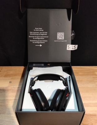 a box with a pair of headphones in it sitting on a table