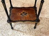 a small table with a decorative design on top of it