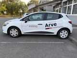 a white car that is parked in a parking lot