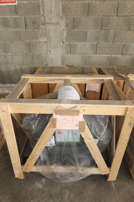 a box with a helmet on top of it in a room