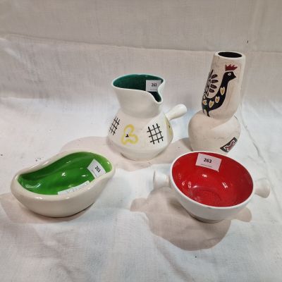 three different types of ceramic vases on a white surface