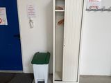 a blue door and a white cabinet in a room