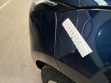 a sticker on the back of a motorcycle that is parked in a parking lot