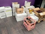 several boxes of wine are stacked next to each other on the floor