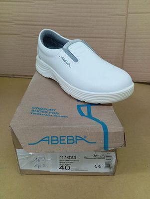 a white shoe that is sitting on top of a box