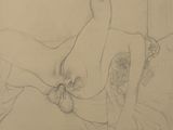 pencil drawing of a nude woman laying on a bed with a pillow